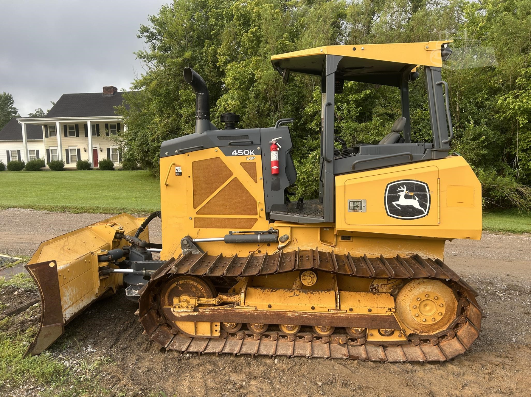 Yellow tracked bulldozer with blade